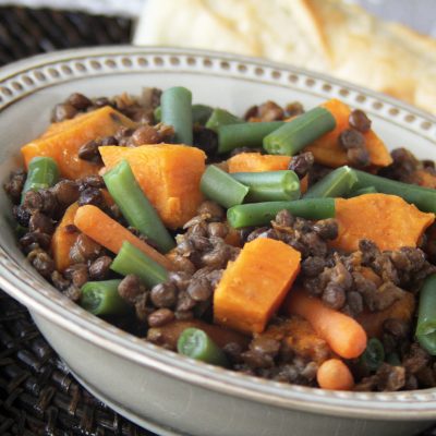 a close up of a bowl of curried sweet potato and lentil stew
