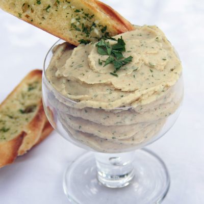 a close up of a cup of lima bean spread