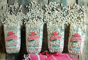 4 opened bags of camellia brande white beans including navy beans, great northern, cannellini, and baby limas