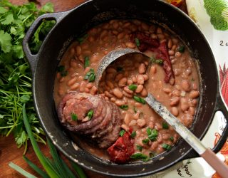 Pinto beans and ham hocks in dutch oven