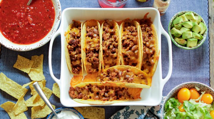 7 oven baked beef and pinto bean tacos in an oven pan