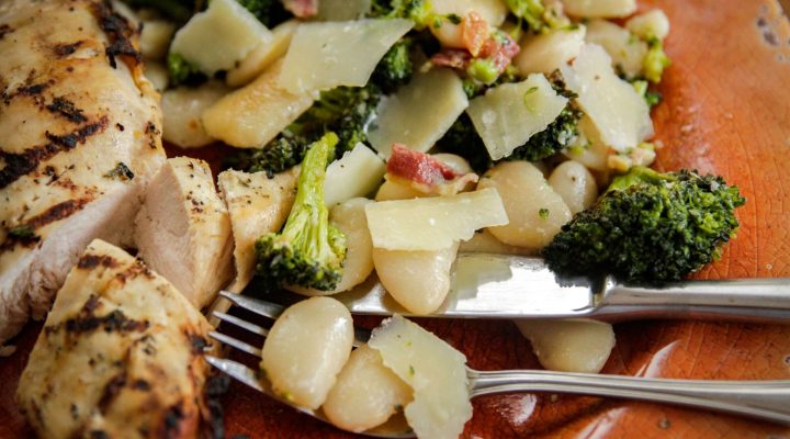 a close up of white bean roasted broccoli