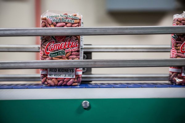 a package of red beans on a conveyor belt