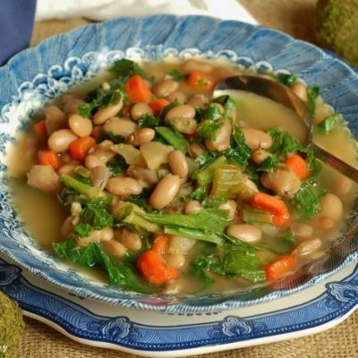 a plate of creole pinto beans and greens soup
