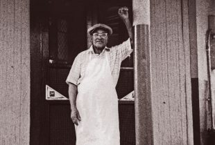 Buster Holmes in front of his restaurant