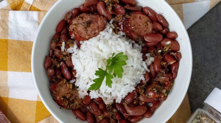 a close up of a bowl of red beans and rice cooked with zydeco chop chop seasoning