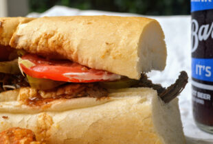 a close up of a poboy using bread from leidenhiemer baker company