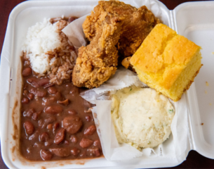 Promo - Hurst Restaurant red beans and rice plate lunch with 2 pieces of chicken, corn bread, and a scoop of mashed potatoes