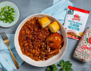 A rich and smoky baked bean dish using Camellia White Beans & Camellia White Bean Flavor Infusion, finished in the oven for that perfect caramelized topping!